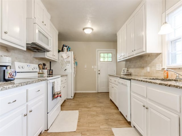 5409 N Walker Ave, Oklahoma City, OK 73118 - kitchen with white appliances, white cabinetry, and decorative backsplash
