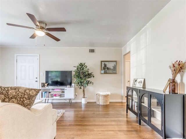 5409 N Walker Ave, Oklahoma City, OK 73118 - living area with light wood-style floors and ceiling fan