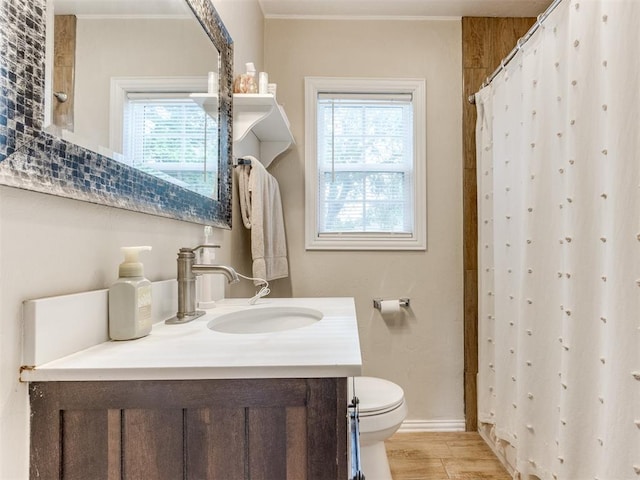 5409 N Walker Ave, Oklahoma City, OK 73118 - full bath featuring vanity, wood finished floors, a shower with curtain, and crown molding