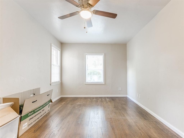 5409 N Walker Ave, Oklahoma City, OK 73118 - empty room with wood finished floors and a ceiling fan