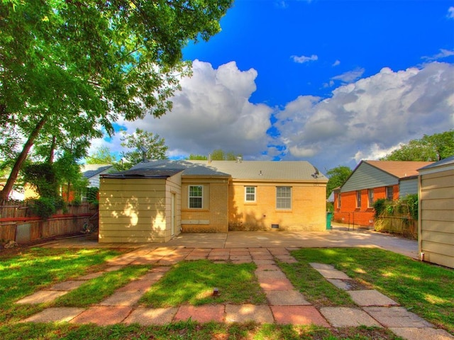5409 N Walker Ave, Oklahoma City, OK 73118 - back of property featuring a patio area and brick siding