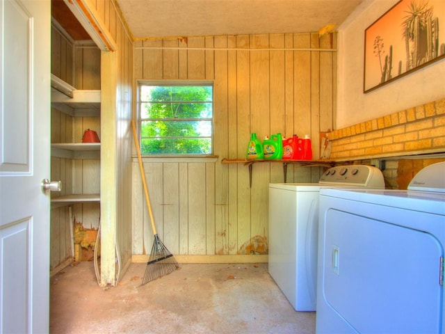 5409 N Walker Ave, Oklahoma City, OK 73118 - laundry area featuring washing machine and clothes dryer and wooden walls