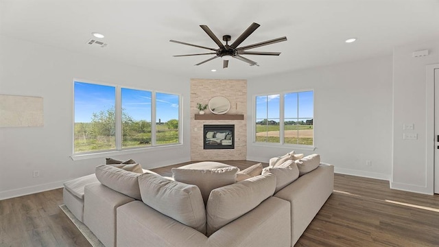 4676 Ranchero Dr, Edmond, OK 73025 - living room featuring ceiling fan, plenty of natural light, a large fireplace, wood finished floors, and recessed lighting