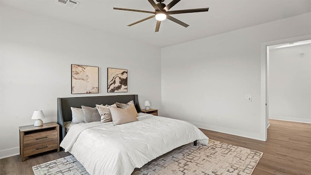 4676 Ranchero Dr, Edmond, OK 73025 - bedroom featuring wood finished floors and ceiling fan