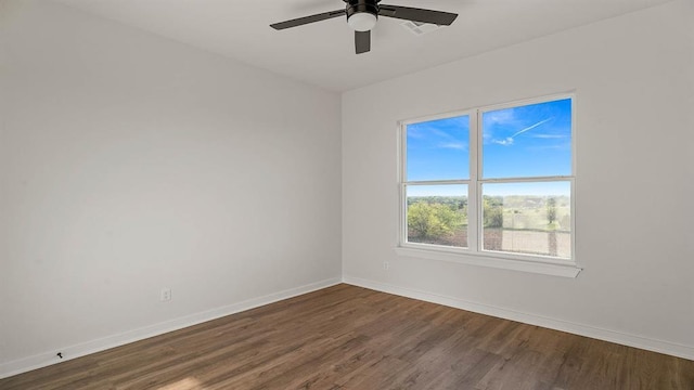 4676 Ranchero Dr, Edmond, OK 73025 - empty room featuring dark wood finished floors and a ceiling fan
