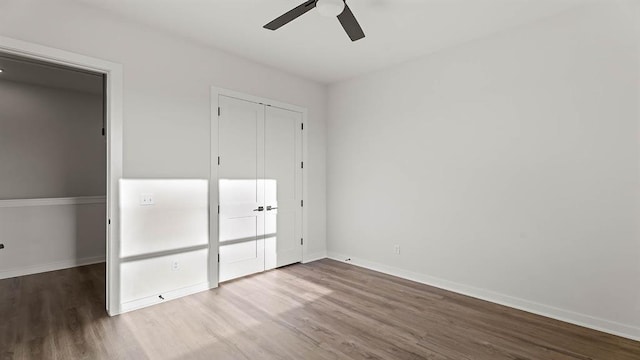 4676 Ranchero Dr, Edmond, OK 73025 - unfurnished bedroom with wood finished floors, a closet, and ceiling fan