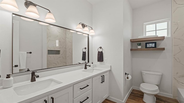 4676 Ranchero Dr, Edmond, OK 73025 - full bathroom featuring double vanity, wood finished floors, a marble finish shower, and a tub to relax in