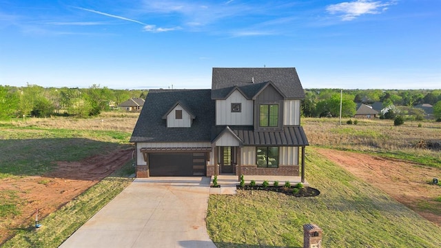 4676 Ranchero Dr, Edmond, OK 73025 - modern farmhouse featuring concrete driveway, brick siding, board and batten siding, an attached garage, and a shingled roof