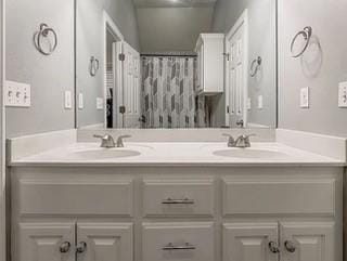 17009 Wales Green Ave, Edmond, OK 73012 - bathroom featuring double vanity