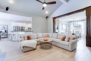 17009 Wales Green Ave, Edmond, OK 73012 - living area featuring ceiling fan, beam ceiling, light wood-style floors, high vaulted ceiling, and recessed lighting