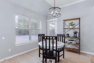 17009 Wales Green Ave, Edmond, OK 73012 - dining area with a chandelier and light wood-style floors