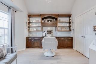 17009 Wales Green Ave, Edmond, OK 73012 - bar with vaulted ceiling and plenty of natural light