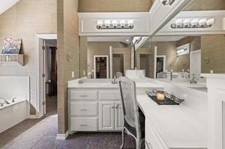 17009 Wales Green Ave, Edmond, OK 73012 - bathroom featuring a bath and vanity