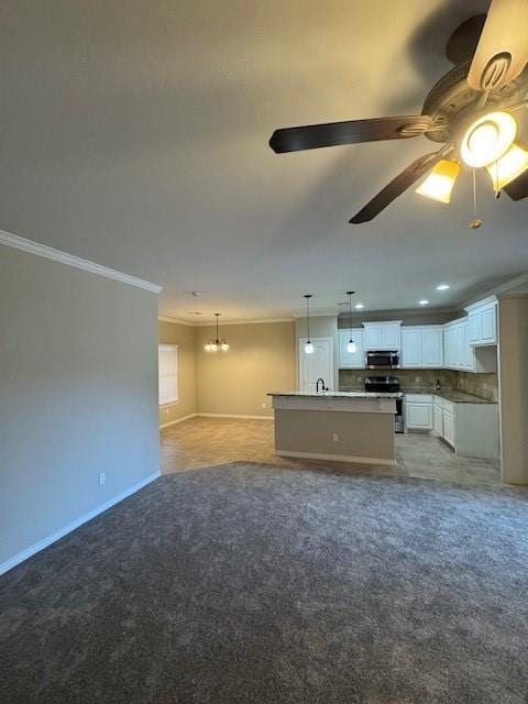 8017 NW 159th St, Edmond, OK 73013 - unfurnished living room featuring crown molding, a chandelier, light carpet, and ceiling fan