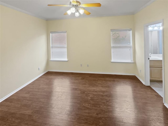 13625 Bell Ave, Oklahoma City, OK 73142 - spare room with dark wood-style flooring, a ceiling fan, and ornamental molding