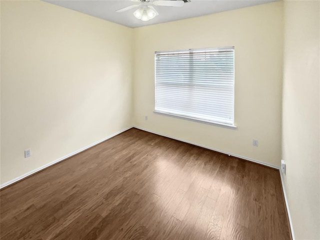 13625 Bell Ave, Oklahoma City, OK 73142 - unfurnished room with dark wood-type flooring and a ceiling fan