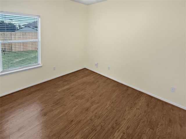 13625 Bell Ave, Oklahoma City, OK 73142 - empty room with dark wood-style flooring