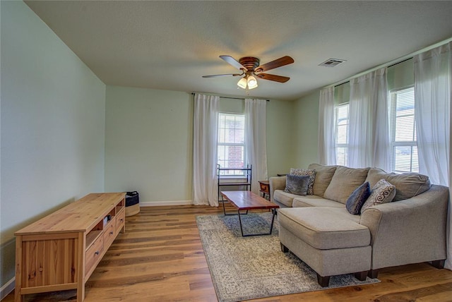 2013 Creekridge Dr, Oklahoma City, OK 73141 - living area with ceiling fan, wood finished floors, and a textured ceiling