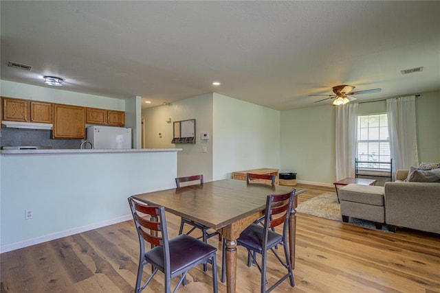 2013 Creekridge Dr, Oklahoma City, OK 73141 - dining room with light wood finished floors, a ceiling fan, and recessed lighting