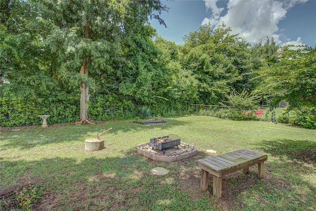 2013 Creekridge Dr, Oklahoma City, OK 73141 - view of green lawn featuring an outdoor fire pit
