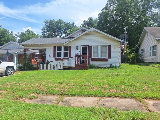 25 E Severn St, Shawnee, OK 74801 - view of front facade with a front yard and a wooden deck