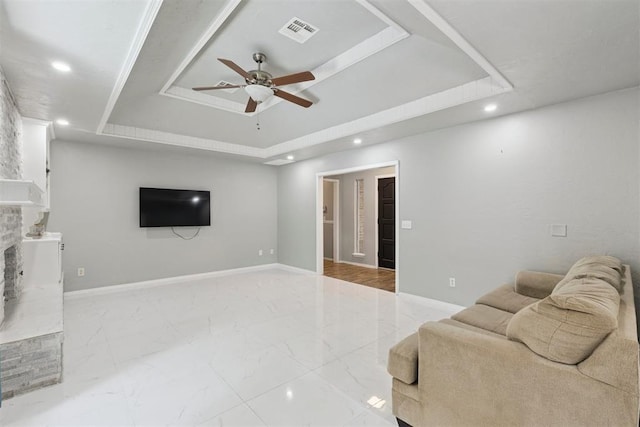 10412 NW 37th St, Yukon, OK 73099 - living area with a tray ceiling, ceiling fan, recessed lighting, and marble finish floors