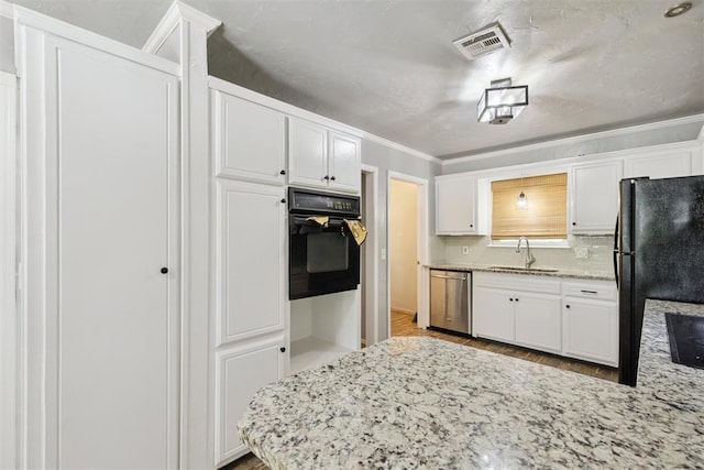 10412 NW 37th St, Yukon, OK 73099 - kitchen featuring black appliances, white cabinetry, ornamental molding, wood finished floors, and light stone countertops