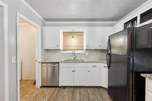 10412 NW 37th St, Yukon, OK 73099 - kitchen featuring freestanding refrigerator, dark wood-type flooring, white cabinets, stainless steel dishwasher, and ornamental molding