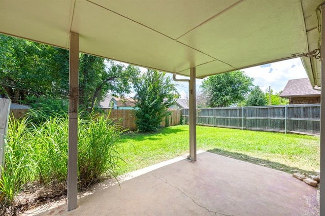 10520 Ricky Ln, Midwest City, OK 73130 - fenced backyard with a patio area