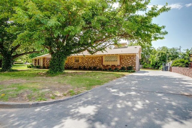 2532 Lancaster Ln, Oklahoma City, OK 73116 - view of front of home with concrete driveway and brick siding
