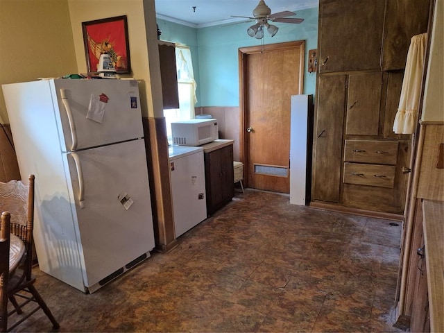 621 S 9th St, Yukon, OK 73099 - kitchen featuring white appliances, ceiling fan, ornamental molding, and light countertops