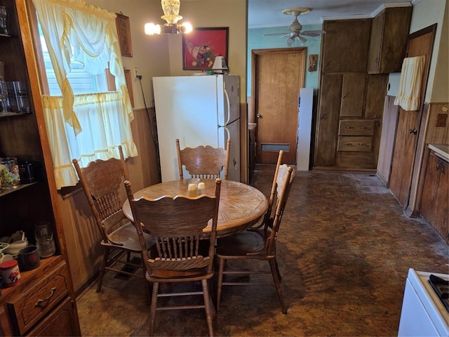 621 S 9th St, Yukon, OK 73099 - dining area featuring a ceiling fan and a chandelier