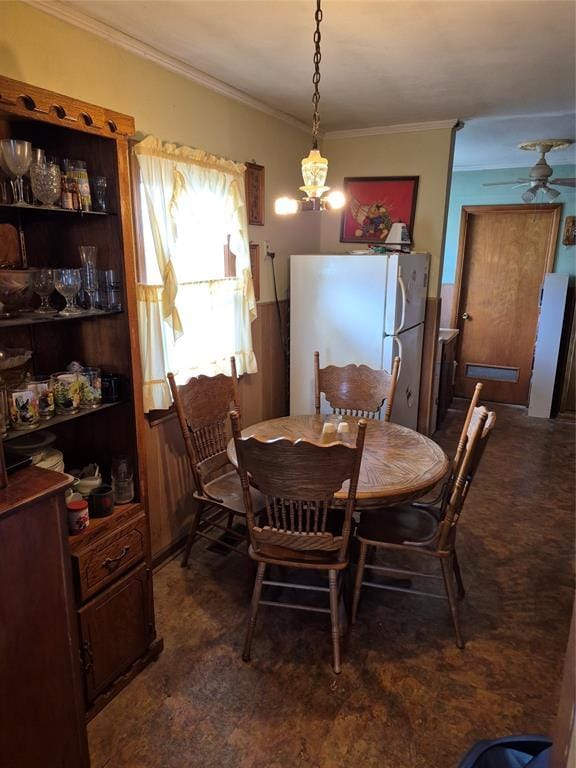 621 S 9th St, Yukon, OK 73099 - dining room featuring ornamental molding, a chandelier, and ceiling fan