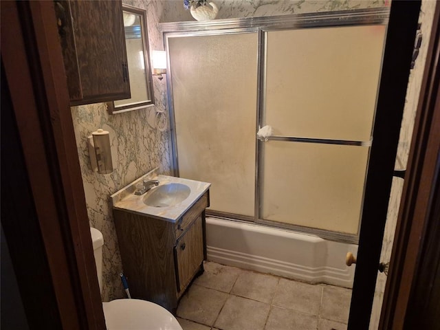 621 S 9th St, Yukon, OK 73099 - bathroom featuring vanity, tile patterned floors, combined bath / shower with glass door, and wallpapered walls