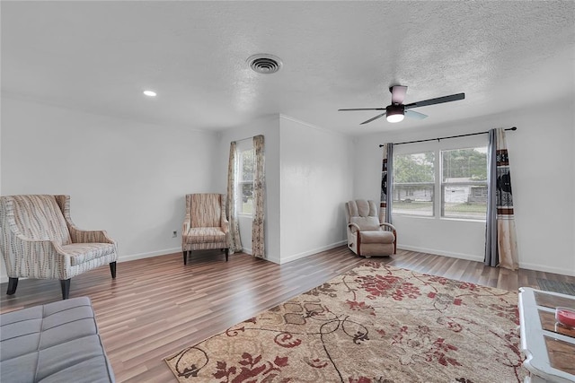 615 N Lowe, Hobart, OK 73651 - living area with wood finished floors, ceiling fan, a textured ceiling, and recessed lighting