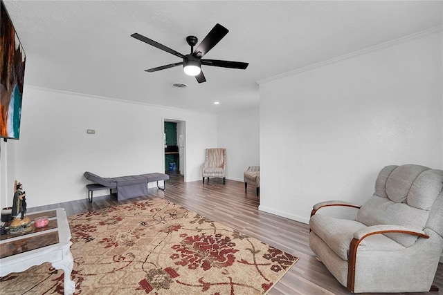 615 N Lowe, Hobart, OK 73651 - living area with ornamental molding, ceiling fan, wood finished floors, and recessed lighting