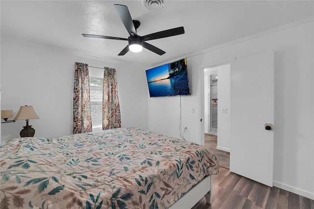 615 N Lowe, Hobart, OK 73651 - bedroom with ornamental molding, dark wood-type flooring, and ceiling fan