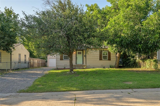 6109 NW 55th St, Oklahoma City, OK 73122 - obstructed view of property featuring a garage and gravel driveway