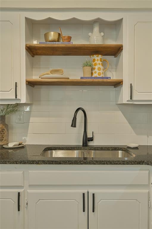 6109 NW 55th St, Oklahoma City, OK 73122 - kitchen featuring open shelves, white cabinetry, decorative backsplash, and dark stone countertops