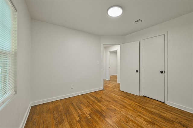 6109 NW 55th St, Oklahoma City, OK 73122 - unfurnished bedroom featuring wood finished floors and baseboards