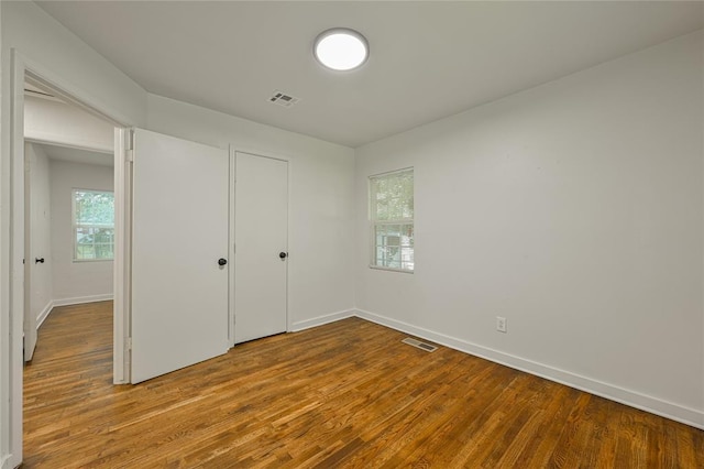6109 NW 55th St, Oklahoma City, OK 73122 - unfurnished bedroom with wood finished floors and baseboards