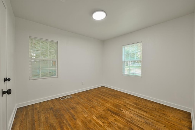 6109 NW 55th St, Oklahoma City, OK 73122 - empty room with dark wood-style flooring and baseboards