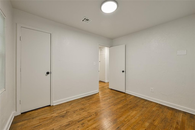 6109 NW 55th St, Oklahoma City, OK 73122 - unfurnished bedroom featuring wood finished floors