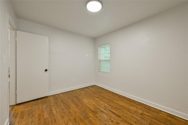 6109 NW 55th St, Oklahoma City, OK 73122 - unfurnished room featuring wood finished floors and baseboards