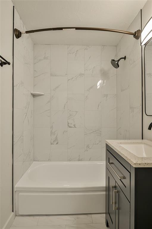6109 NW 55th St, Oklahoma City, OK 73122 - full bathroom with marble look tiles, vanity, and washtub / shower combination