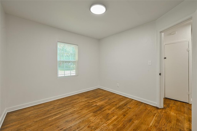 6109 NW 55th St, Oklahoma City, OK 73122 - spare room with wood finished floors and baseboards