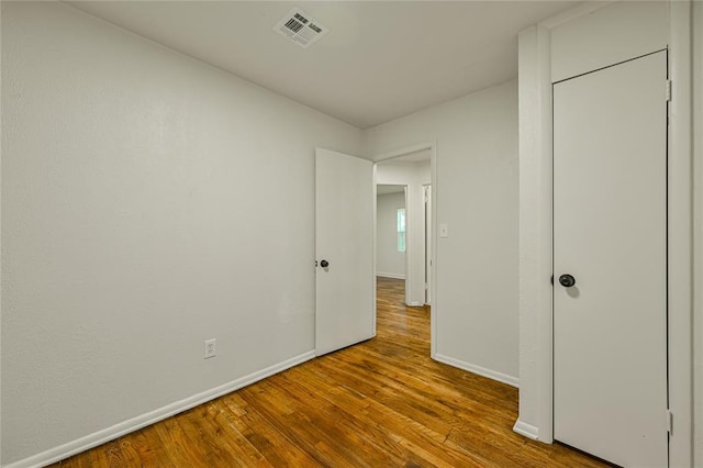 6109 NW 55th St, Oklahoma City, OK 73122 - unfurnished bedroom featuring baseboards and wood finished floors