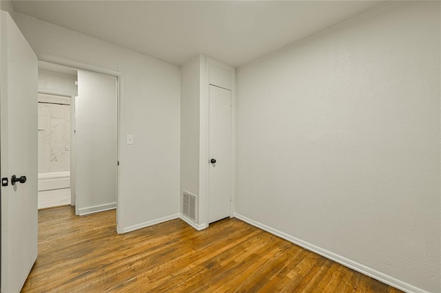 6109 NW 55th St, Oklahoma City, OK 73122 - unfurnished bedroom with wood finished floors and a closet