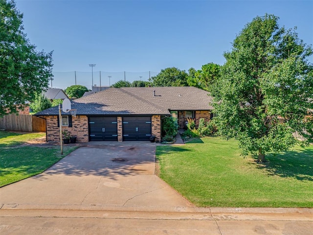 617 Hoehner Ave, Okarche, OK 73762 - single story home with an attached garage, driveway, brick siding, and roof with shingles
