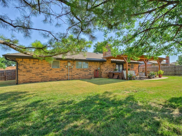 617 Hoehner Ave, Okarche, OK 73762 - rear view of house with a patio area, brick siding, and a chimney
